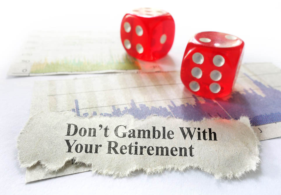 a pair of dice on a table with pictures of stock graphs and a quote that says dont gambe with your retirement