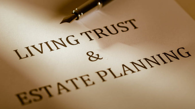 Fountain Pen Lying On The “Living Trust And Estate Planning” – Close Up